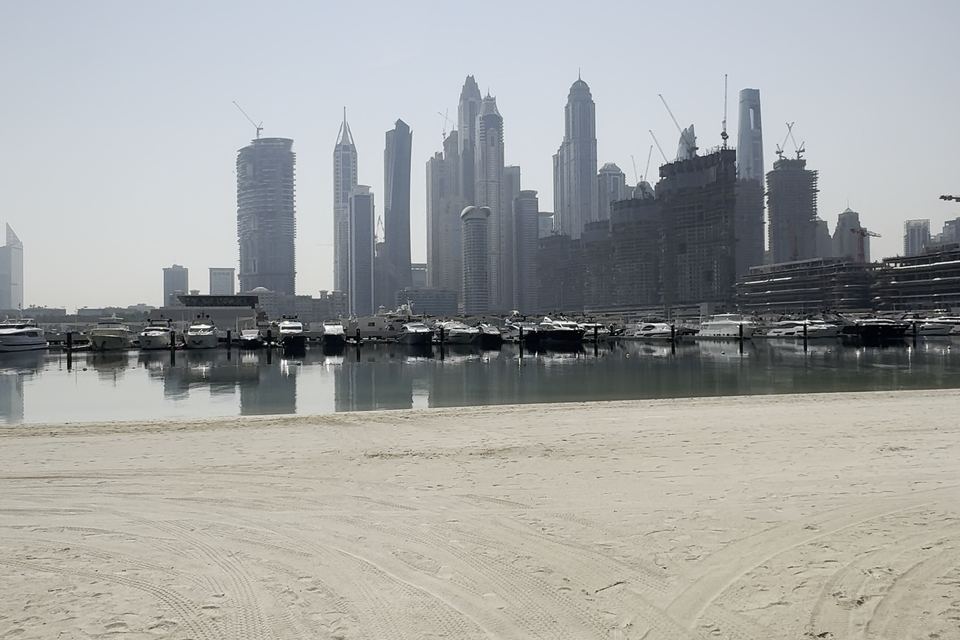 Dubai marina skyline from beach, photo by Zuzanna Kindler-Narbutt